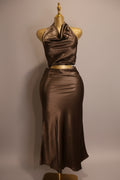 Brown satin halter top and pencil skirt set on a mannequin against a plain wall.