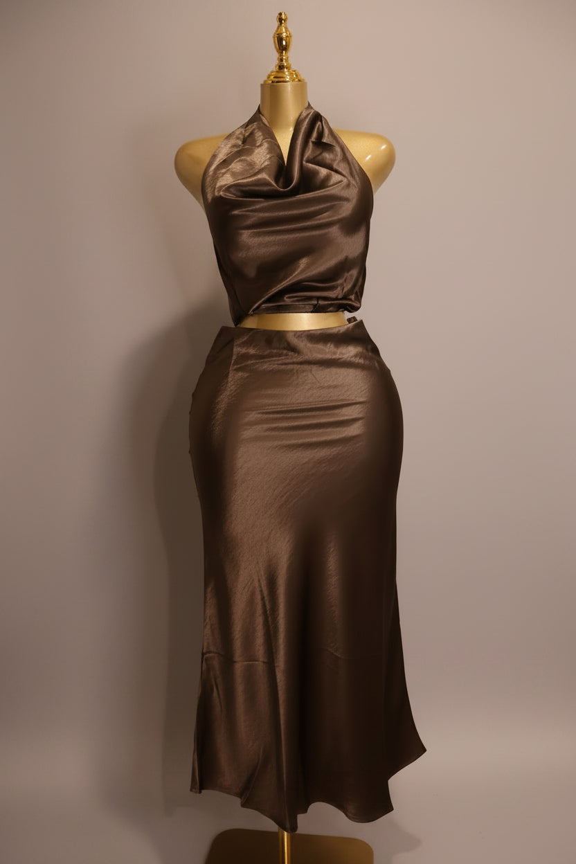 Brown satin halter top and pencil skirt set on a mannequin against a plain wall.